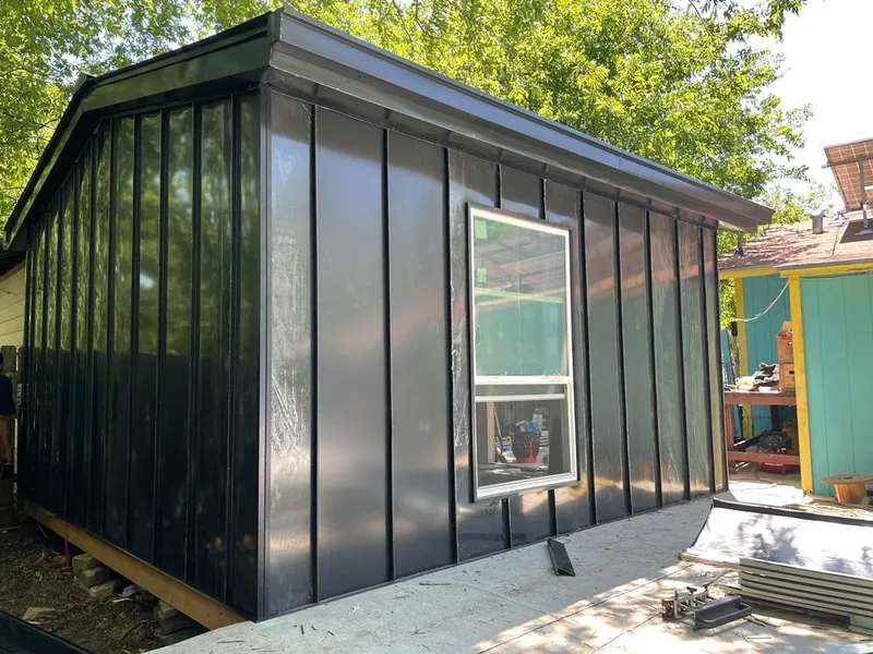 Black standing seam metal wall panels for Metal Roof Installation in Foley