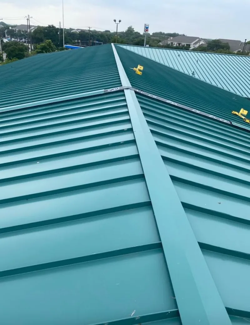Green commercial metal roof ridge and valley for Metal Roof Repair in Foley